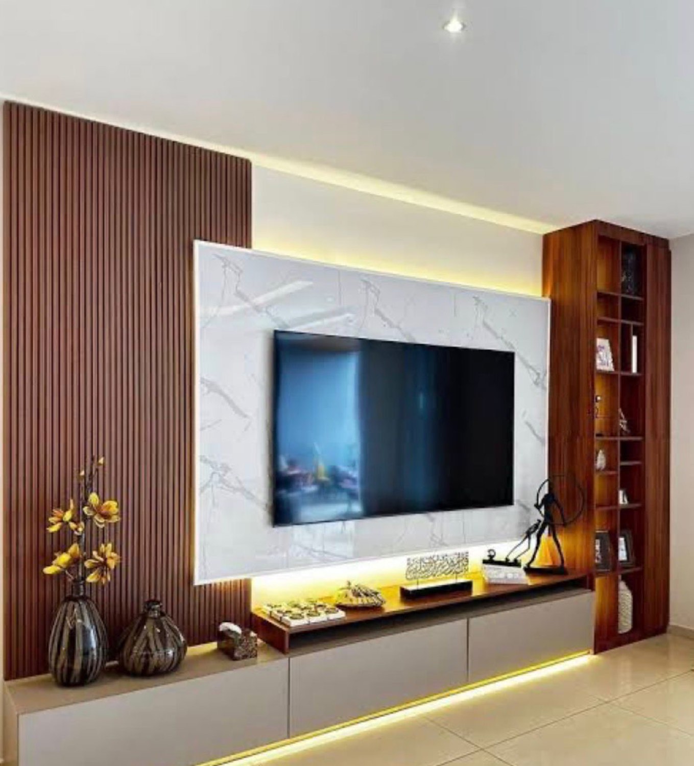 Marble-look media wall with warm wood panelling