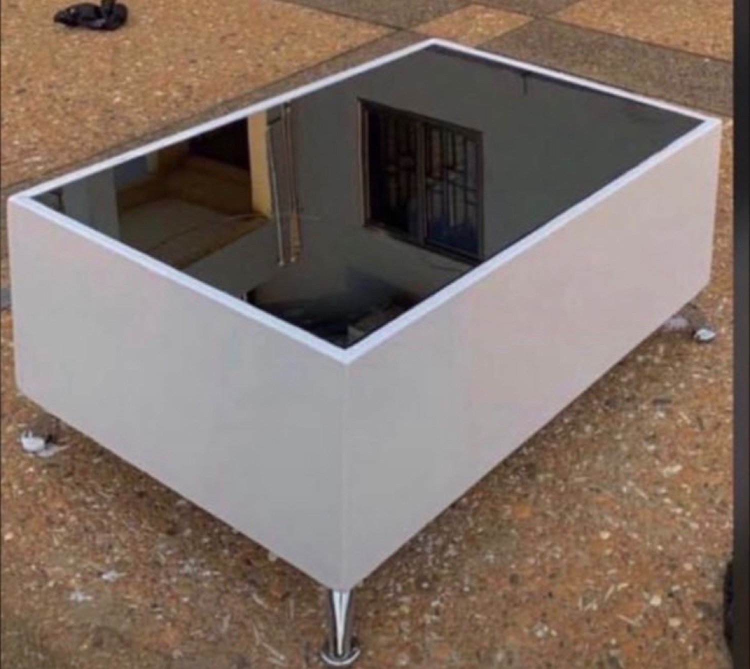 Grey gloss centre table with a mirror top made in Kumasi