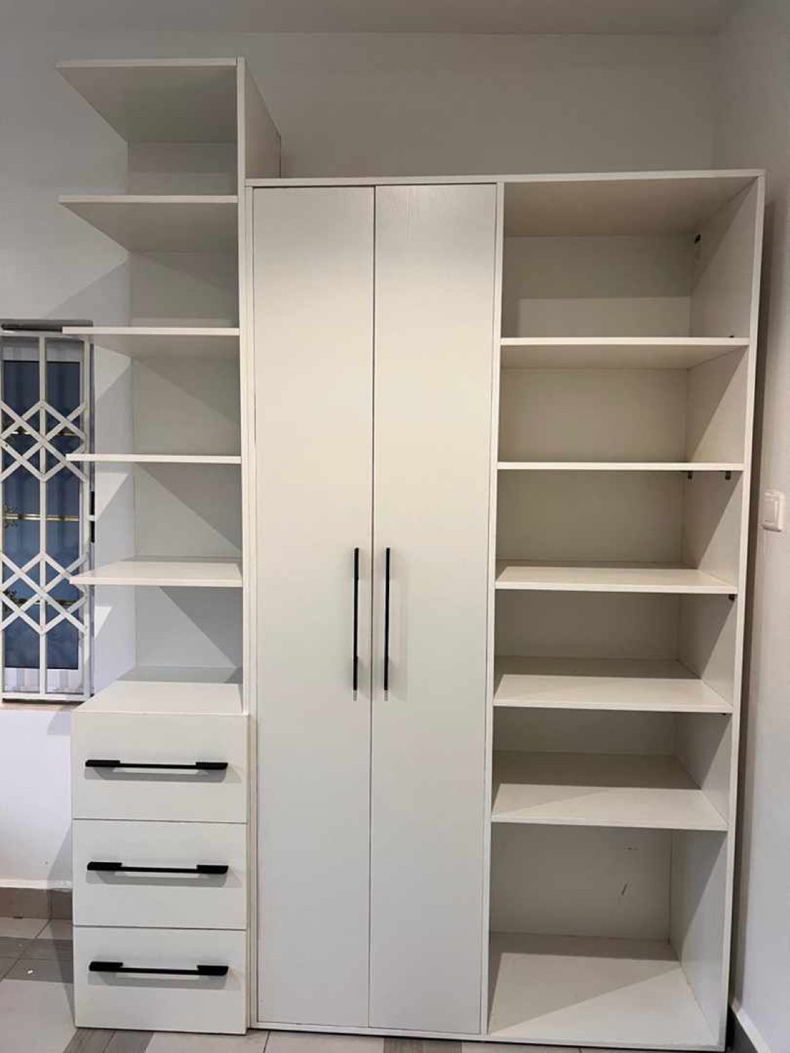 Fitted wardrobe with drawers and open shelving